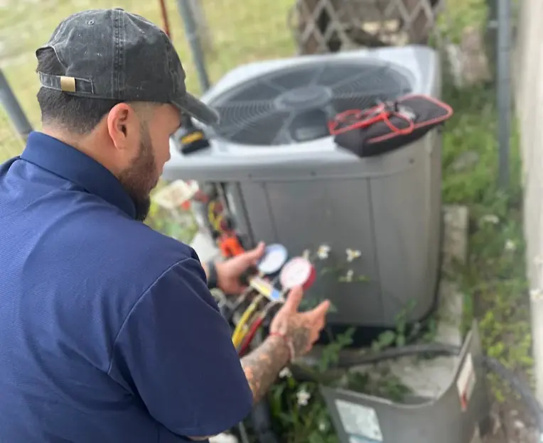 Premier Frost HVAC technician servicing an AC unit in Deltona, Florida
